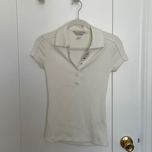 Ivory ribbed polo with snap front closure